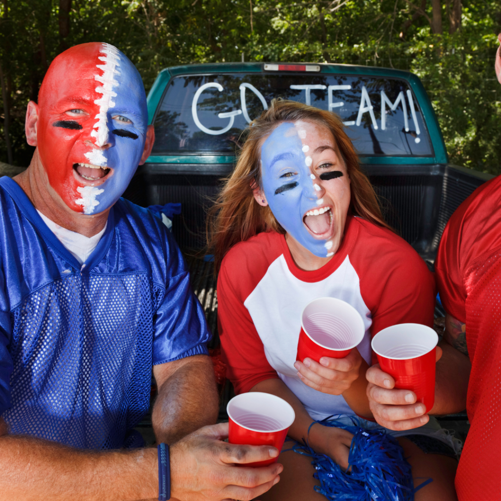 Football Tailgate party painted faces holding cups